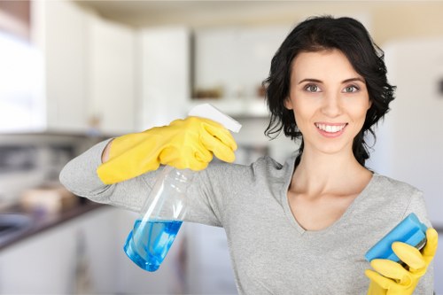 Professional office cleaners working in a W1 workspace