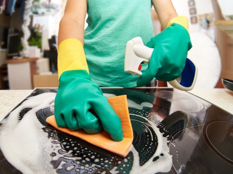 Professional carpet cleaners working safely with equipment and protective gear